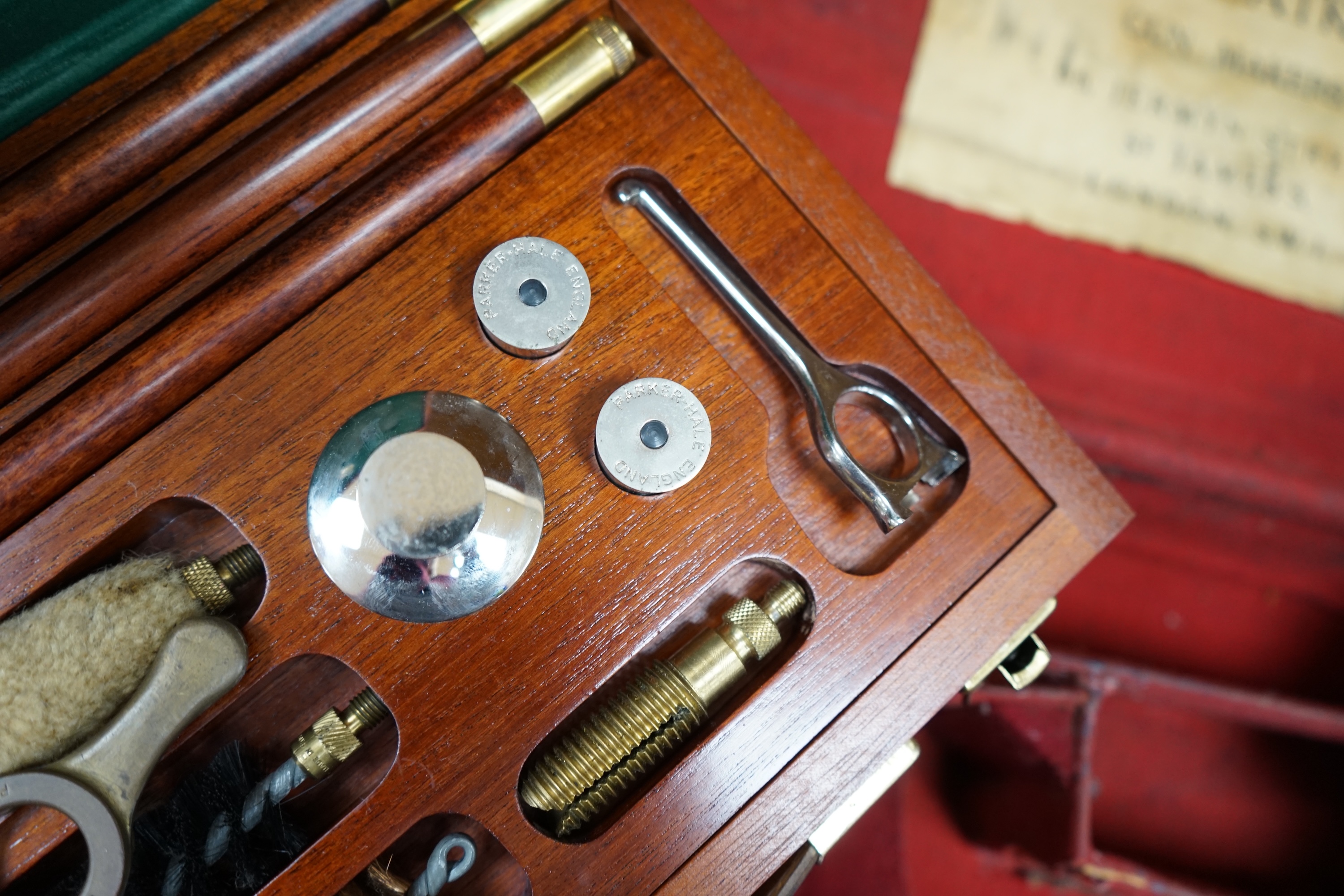 Two cases of gun cleaning equipment and a 19th century leather gun case, 83cm long. Condition - fair to good